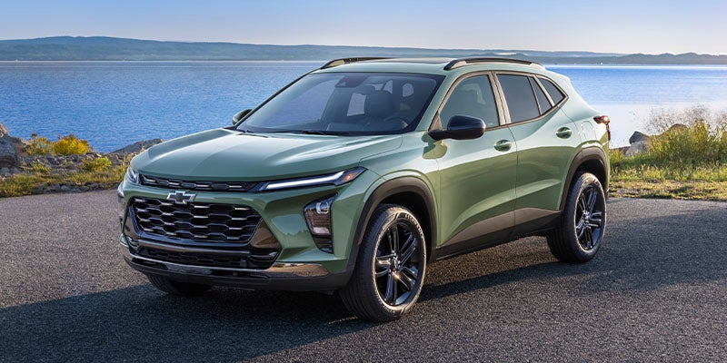 green Chevrolet Trax standing near seashore